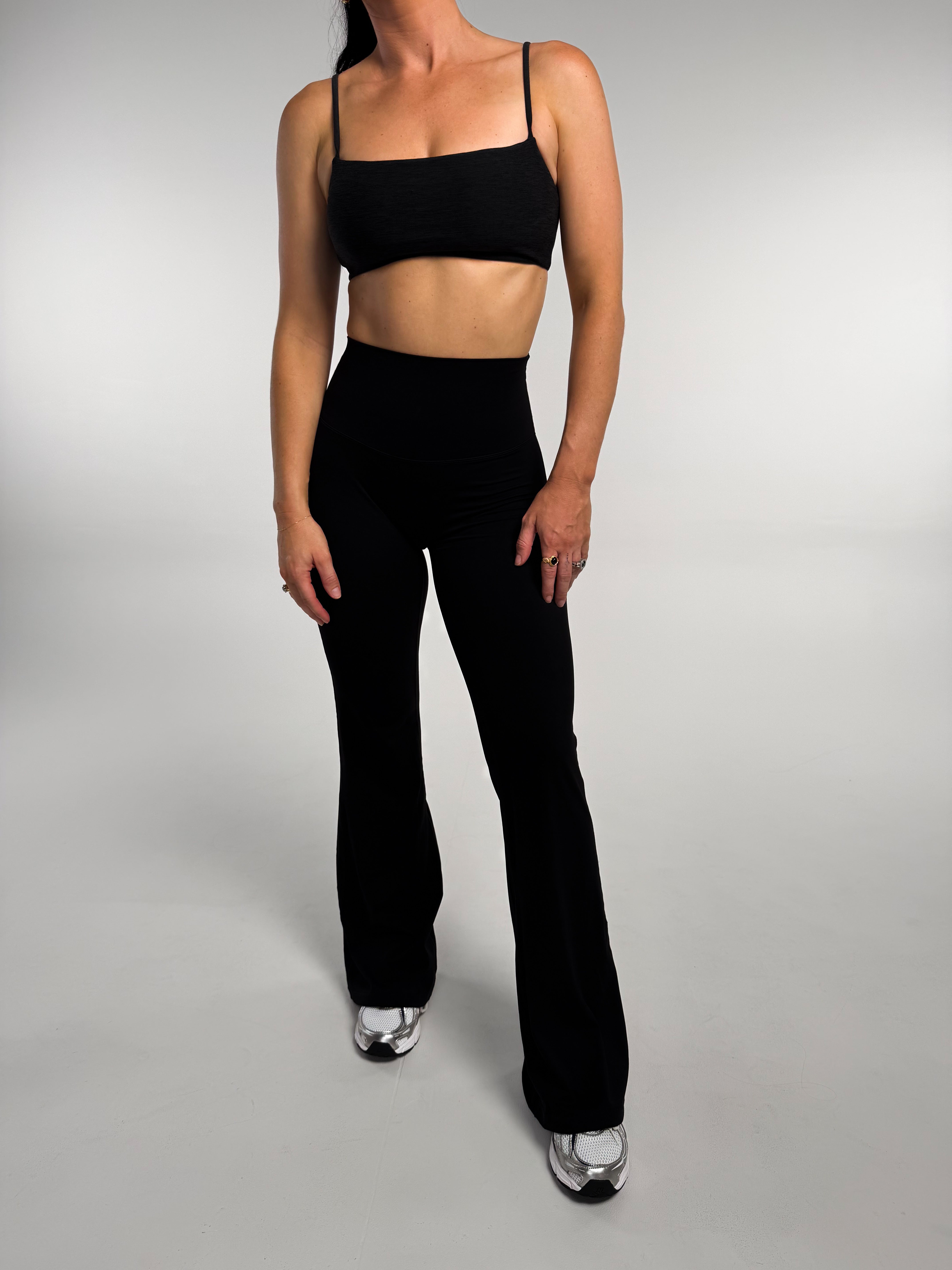 Active girl wearing Noa with a flare tight. buttery soft fabric