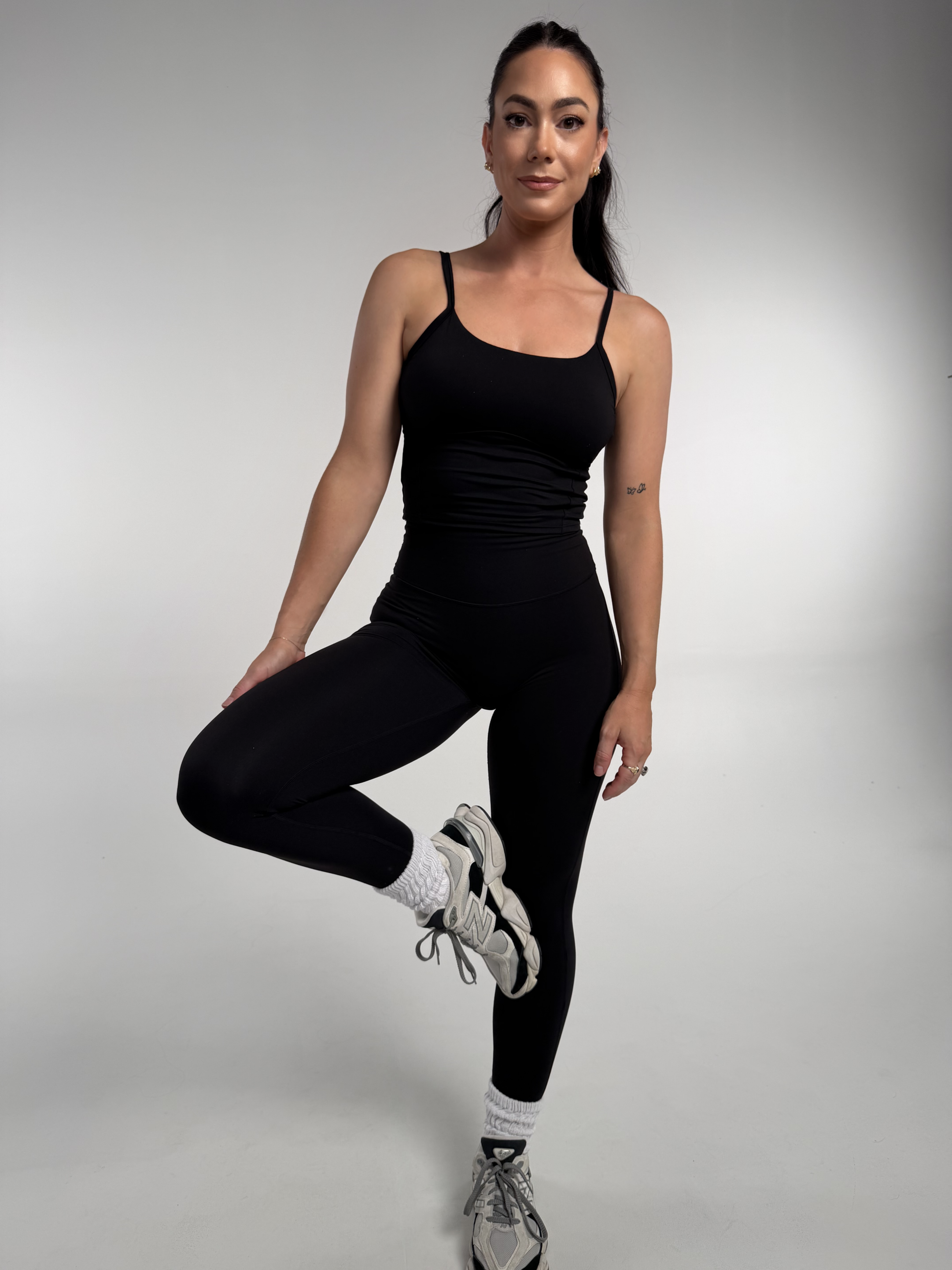 Active girl in the black NR skinny tights made from our Noa premium fabric tight. 
