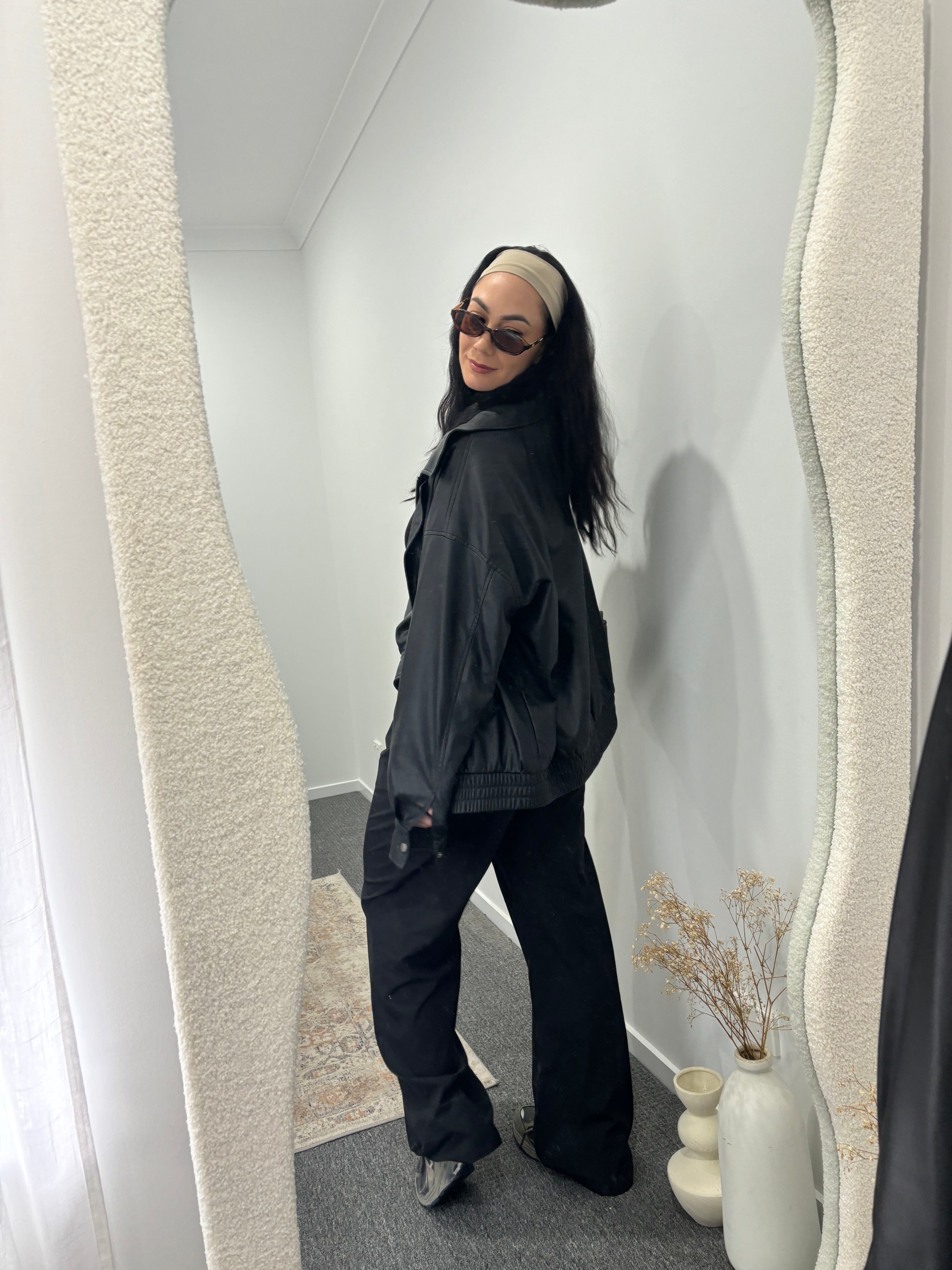 Girl wearing black Noa Rae, Drew pants 